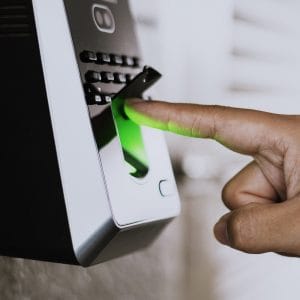 Scanning finger on a coronavirus contaminated fingerprint access control